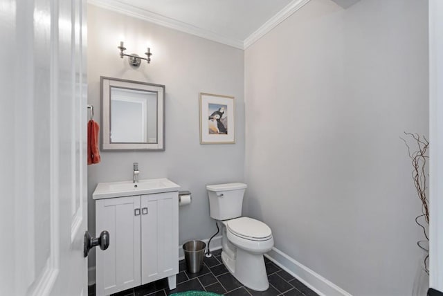 half bath with toilet, vanity, baseboards, tile patterned floors, and crown molding