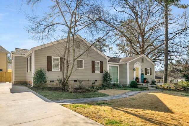 bungalow-style home with crawl space, a front yard, and fence