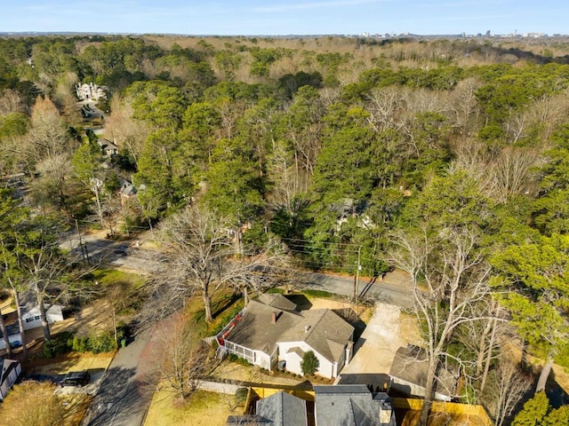 aerial view featuring a wooded view