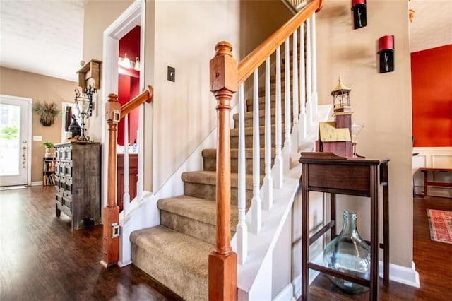 staircase with wood finished floors