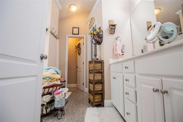 bathroom with baseboards and vanity