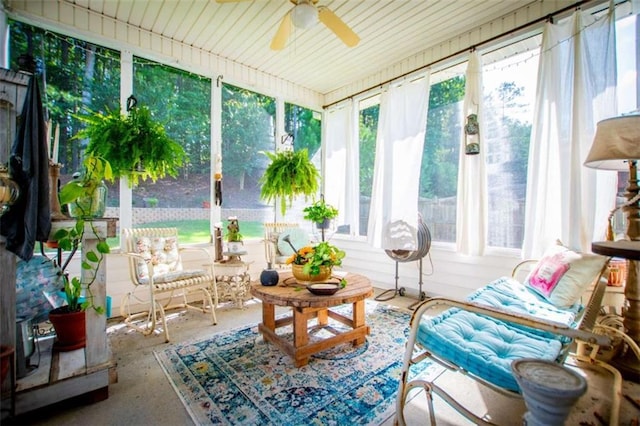 sunroom featuring ceiling fan