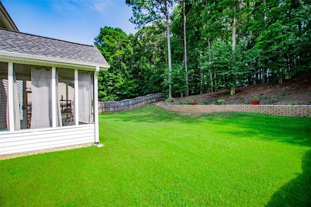 view of yard featuring a sunroom