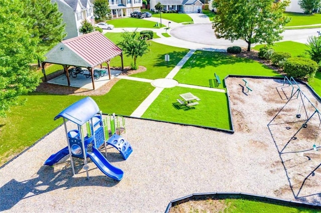 view of community with a residential view, playground community, a lawn, and a gazebo