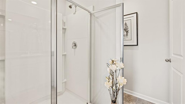 bathroom with a shower with shower door