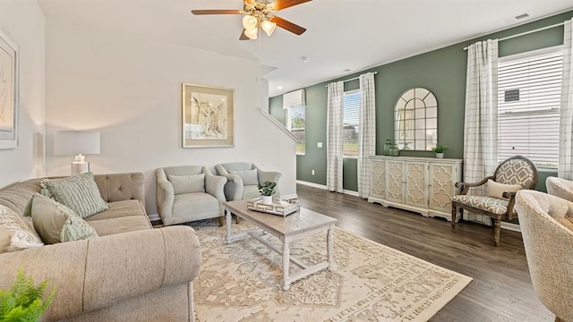 living room featuring hardwood / wood-style flooring and ceiling fan