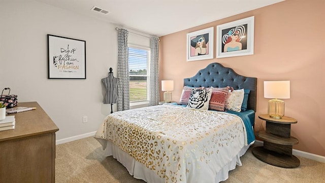 bedroom featuring light colored carpet