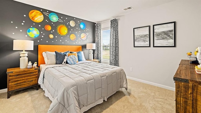 bedroom featuring light colored carpet