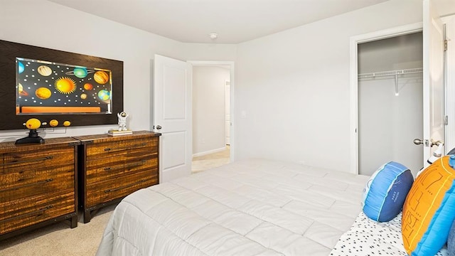 bedroom featuring light carpet and a closet