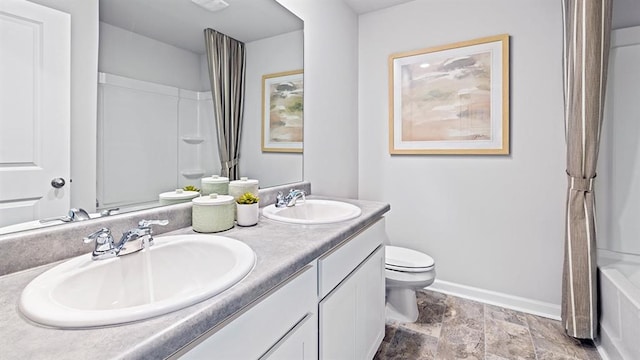 full bathroom featuring vanity, shower / bath combo with shower curtain, and toilet