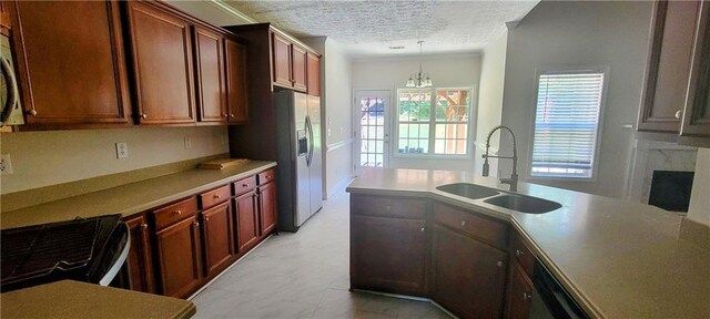 kitchen featuring pendant lighting, sink, electric range oven, ornamental molding, and a textured ceiling