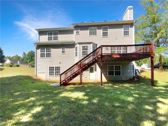 rear view of house with stairs, a chimney, a deck, and a lawn