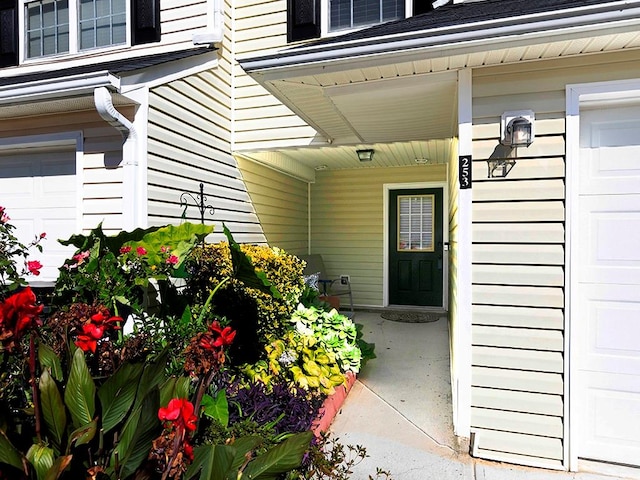 doorway to property featuring a garage