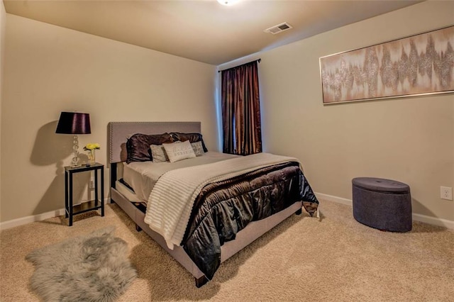 bedroom with carpet, visible vents, and baseboards