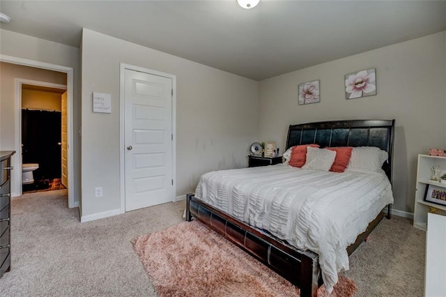 bedroom with carpet and baseboards