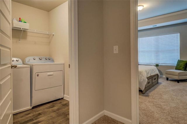 laundry room featuring laundry area, baseboards, carpet flooring, and washing machine and clothes dryer