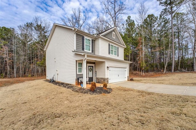 view of front of house with stone siding, driveway, and an attached garage