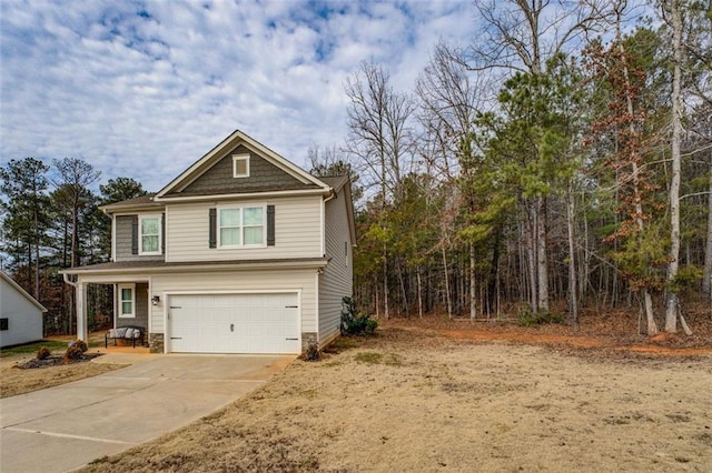 view of front of home featuring a garage and concrete driveway