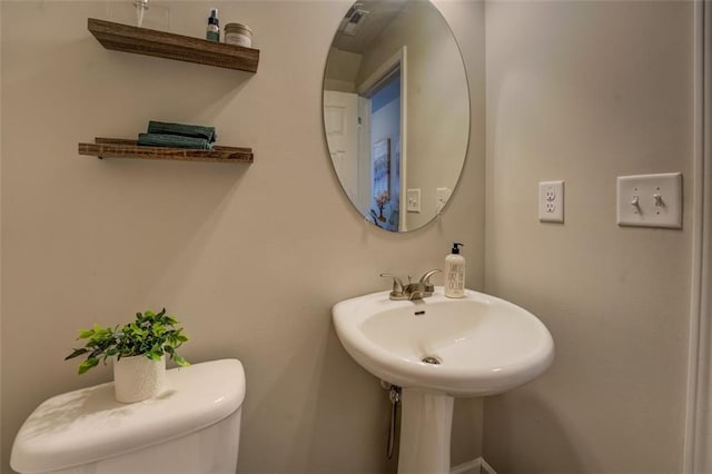 bathroom featuring toilet