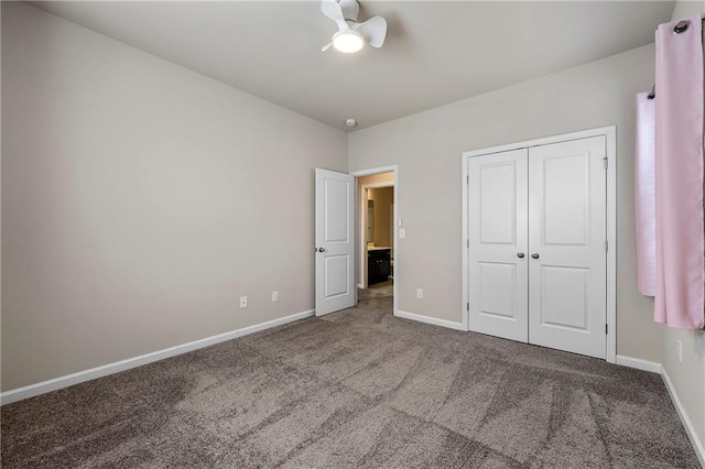 unfurnished bedroom featuring carpet floors, a closet, and ceiling fan