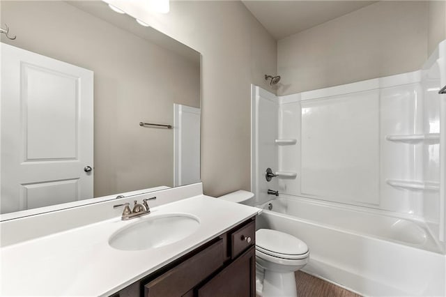 full bathroom featuring vanity, shower / bathtub combination, and toilet