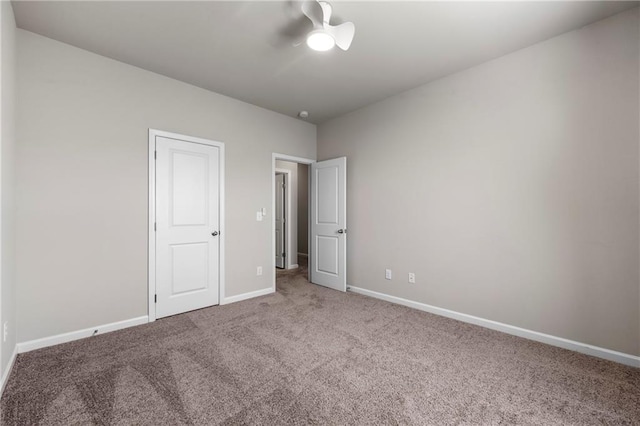 unfurnished bedroom featuring carpet flooring and ceiling fan