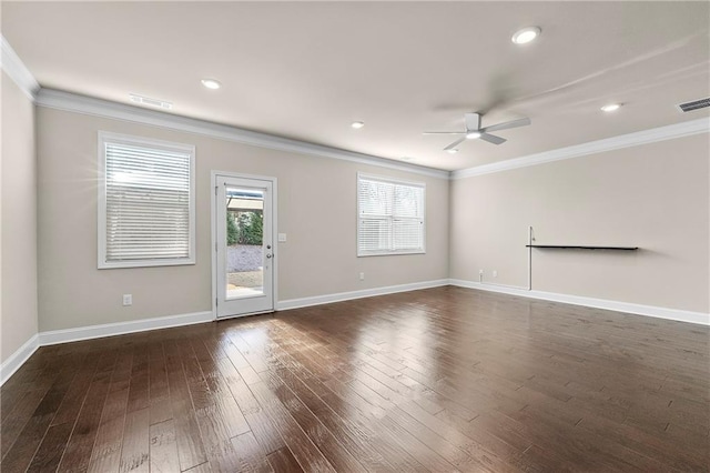 empty room with dark hardwood / wood-style flooring, ornamental molding, and ceiling fan