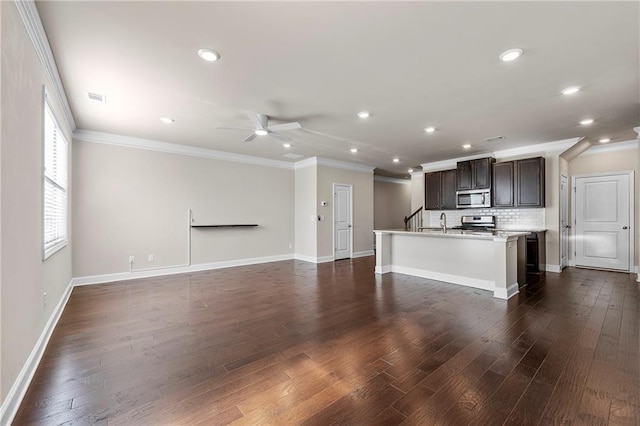 unfurnished living room featuring dark hardwood / wood-style flooring, sink, crown molding, and ceiling fan