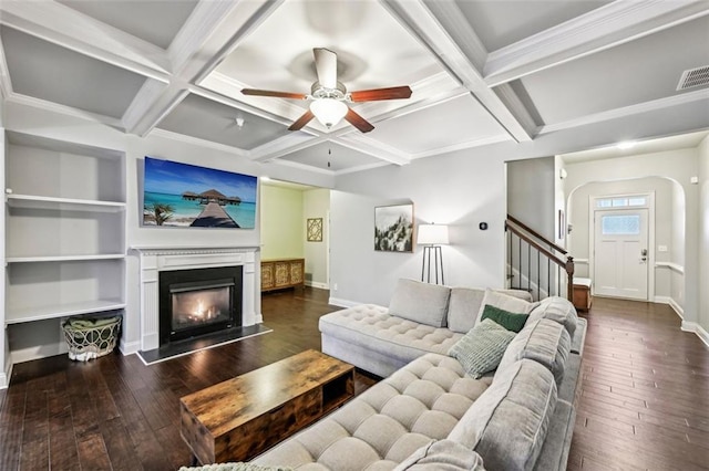 living room featuring coffered ceiling, ceiling fan, dark wood-type flooring, and beamed ceiling