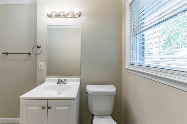 bathroom featuring toilet and vanity