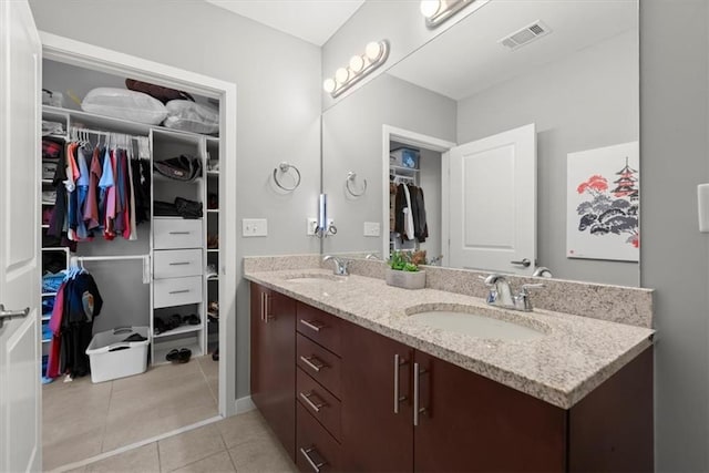 400 W Peachtree St NW Unit 3611, Atlanta, GA 30308 - bathroom featuring tile patterned flooring, double vanity, and a spacious closet