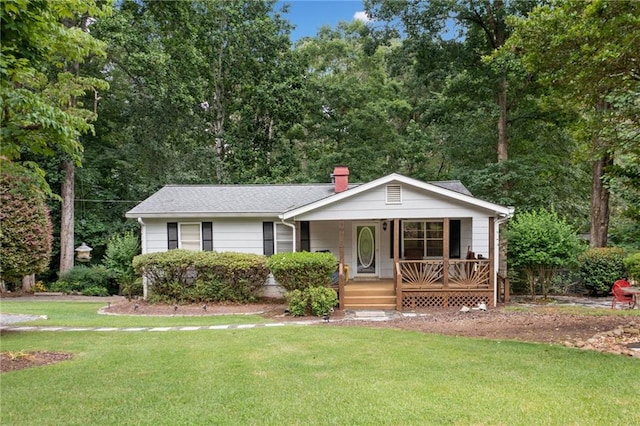307 Little Hickory Ln, Woodstock, GA 30189 - view of front facade with a porch, a front lawn, and a chimney
