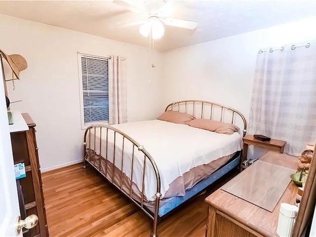 307 Little Hickory Ln, Woodstock, GA 30189 - bedroom featuring wood finished floors and a ceiling fan