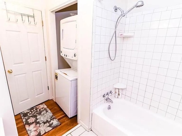 307 Little Hickory Ln, Woodstock, GA 30189 - bathroom featuring stacked washer and clothes dryer, shower / bathtub combination, and wood finished floors