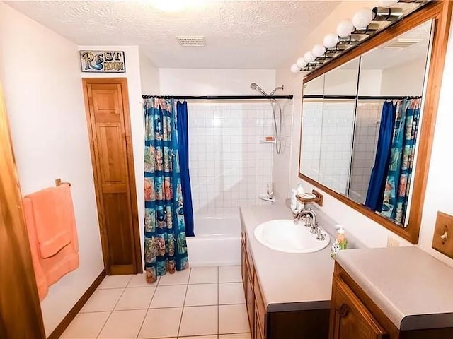 307 Little Hickory Ln, Woodstock, GA 30189 - bathroom featuring vanity, shower / bathtub combination with curtain, tile patterned flooring, and a textured ceiling
