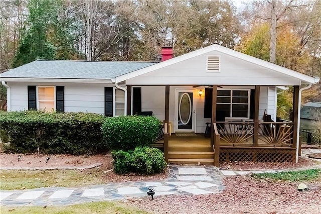 307 Little Hickory Ln, Woodstock, GA 30189 - view of front of house featuring covered porch, a chimney, and roof with shingles