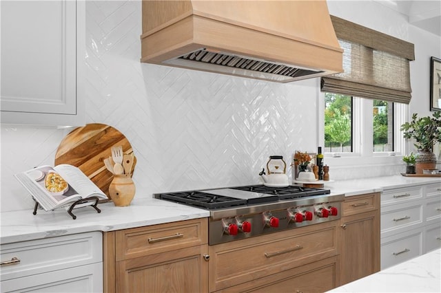 10155 Cedar Ridge Dr, Milton, GA 30004 - kitchen with custom exhaust hood, stainless steel gas stovetop, decorative backsplash, and light stone counters