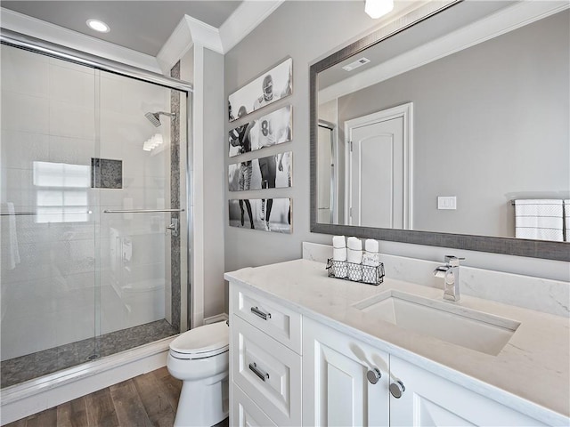 10155 Cedar Ridge Dr, Milton, GA 30004 - full bath featuring toilet, a stall shower, vanity, ornamental molding, and wood finished floors