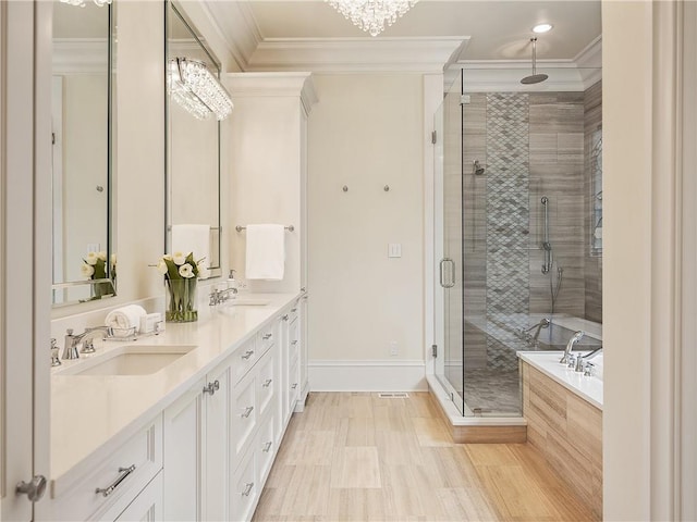 10155 Cedar Ridge Dr, Milton, GA 30004 - bathroom featuring ornamental molding, double vanity, a stall shower, baseboards, and a garden tub