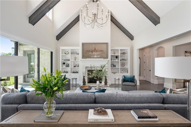 10155 Cedar Ridge Dr, Milton, GA 30004 - living area featuring a chandelier, high vaulted ceiling, beam ceiling, and a fireplace