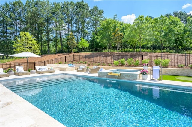 10155 Cedar Ridge Dr, Milton, GA 30004 - view of swimming pool featuring a pool with connected hot tub, outdoor lounge area, a patio, and view of wooded area