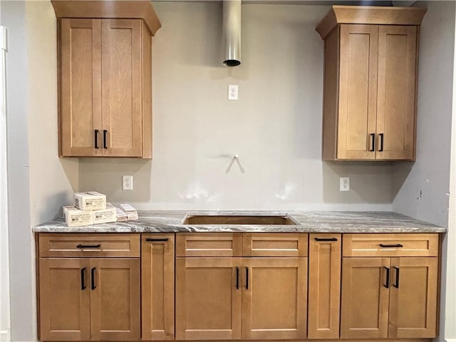 kitchen with light stone countertops