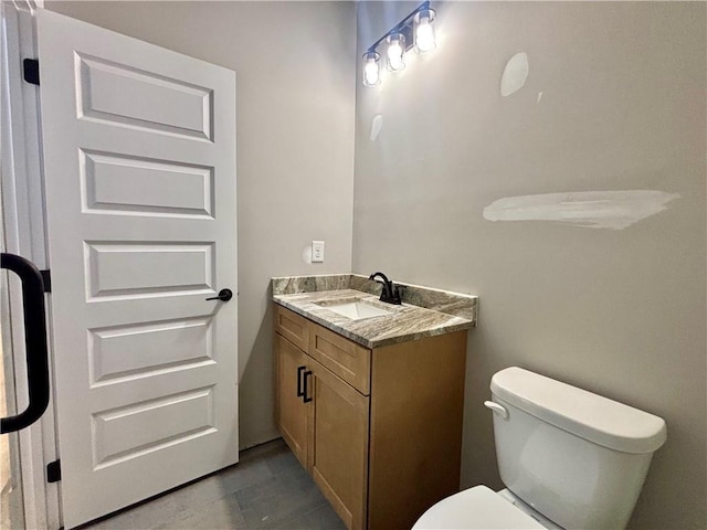 half bath with toilet and vanity