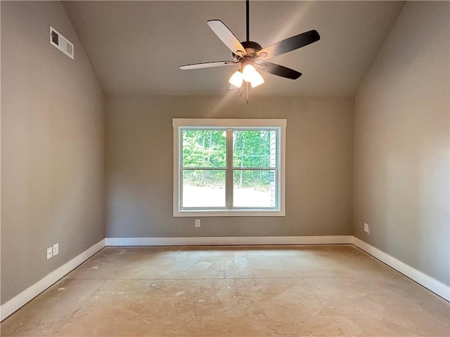 spare room featuring vaulted ceiling, ceiling fan, baseboards, and visible vents