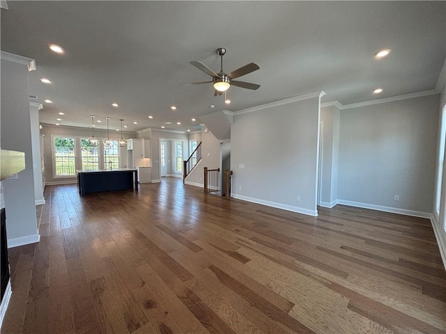 kitchen with sink, dishwasher, white cabinetry, dark hardwood / wood-style floors, and an island with sink