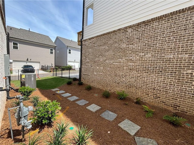 view of side of home featuring a lawn