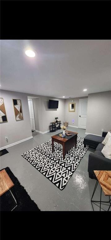 living room featuring concrete flooring