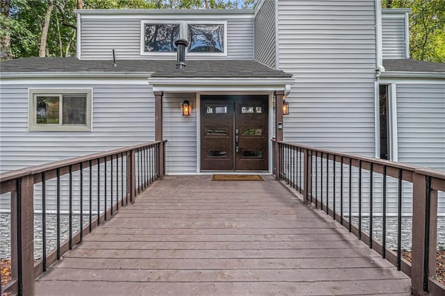 doorway to property featuring a deck and french doors