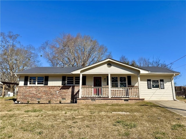 ranch-style house featuring a porch, crawl space, brick siding, and a front lawn