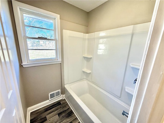 bathroom featuring visible vents, baseboards, and wood finished floors